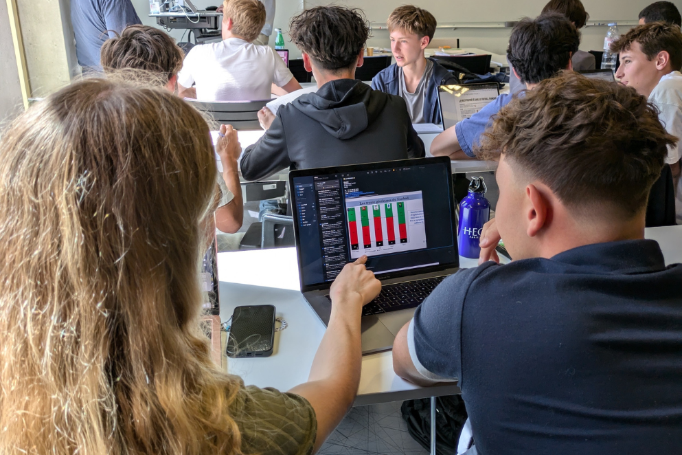 Student pointing at graphs