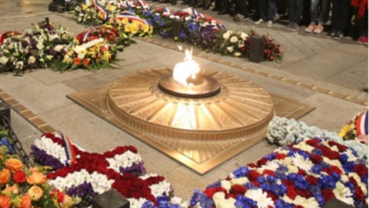 REKINDLE THE FLAME UNDER THE ARC DE TRIOMPHE 